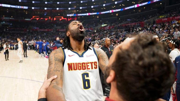 Denver Nuggets center DeAndre Jordan warms up before an NBA...