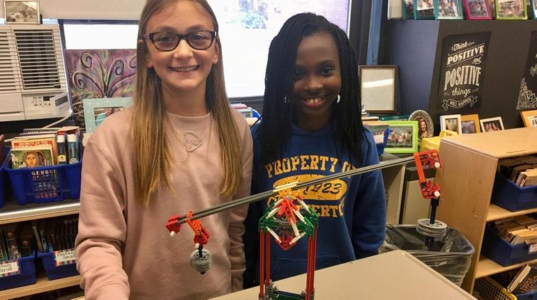 Kidsday reporters Hannah Lewis, left, and Yolina Bastien with the...