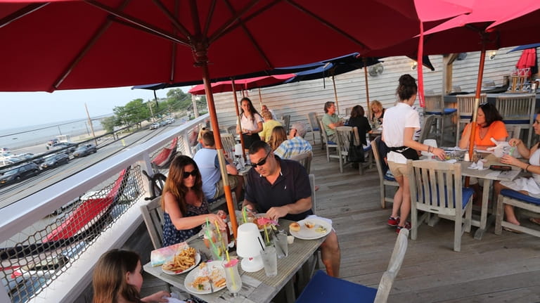 Patrons can sit on the roof deck patio of Shipwreck...