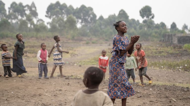 13 year-old Arusi Wegeneza plays with children at 'The Soga...