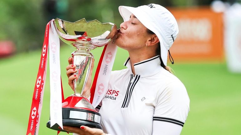 Hannah Green of Australia kisses he trophy after winning the...