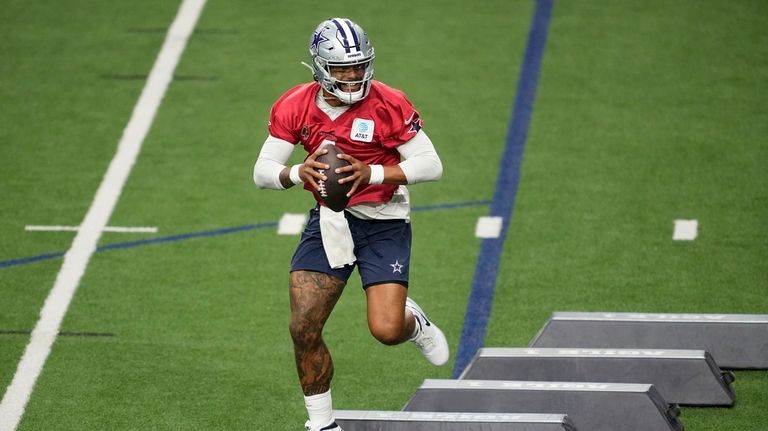 Dallas Cowboys quarterback Dak Prescott (4) runs drills during an...