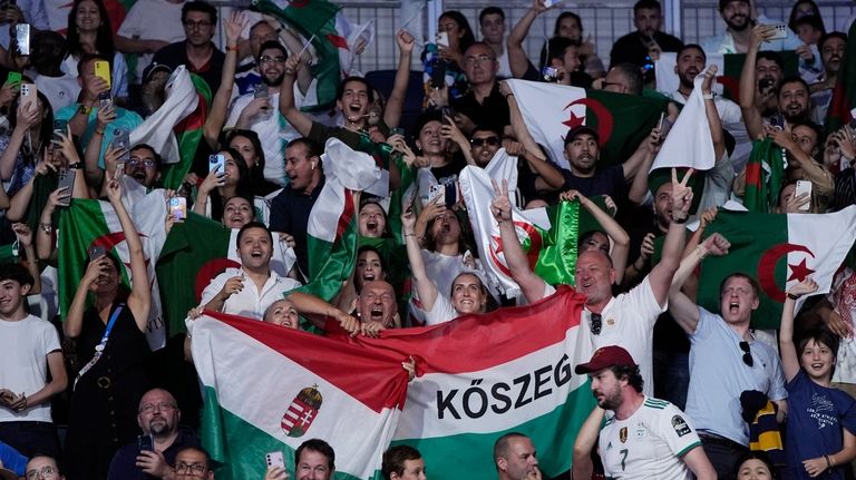 Fans cheer before Algeria's Imane Khelif and Hungary's Anna Hamori...