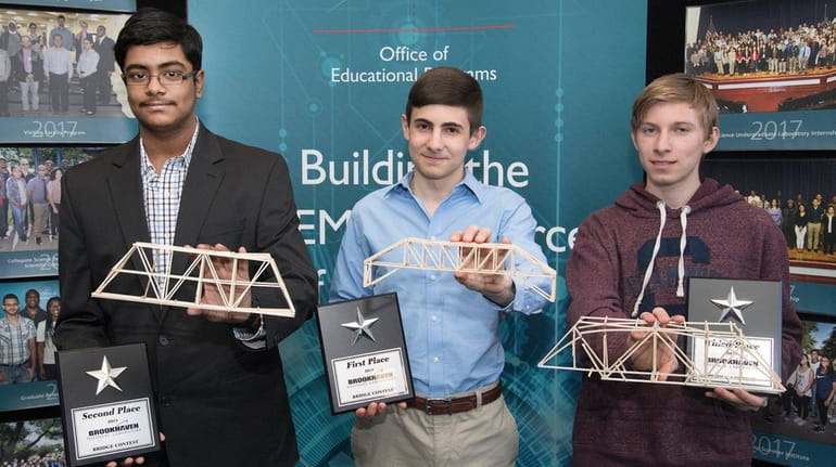 Justin Wallace, center, took first place in Brookhaven National Laboratory's...