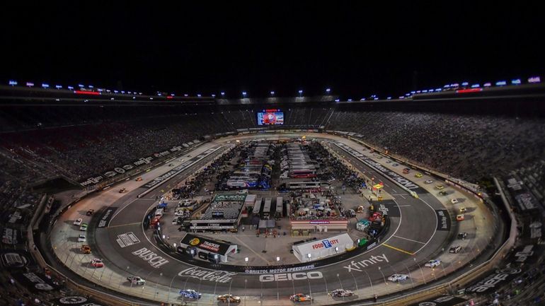 Drivers make their way around Bristol Motor Speedway during a...