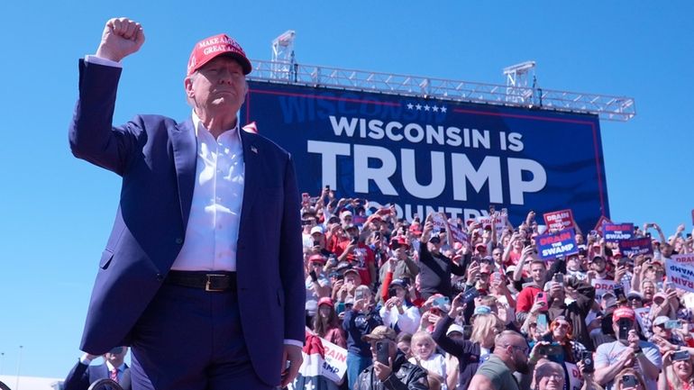 Republican presidential nominee former President Donald Trump arrives to speak...