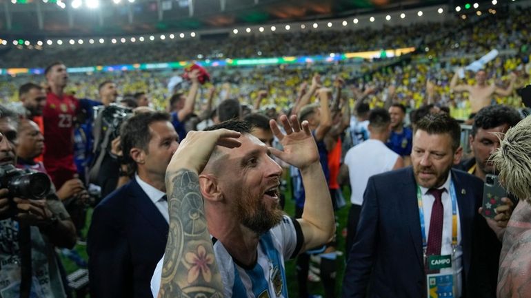 Argentina's Lionel Messi and teammates celebrate their team's 1-0 victory...