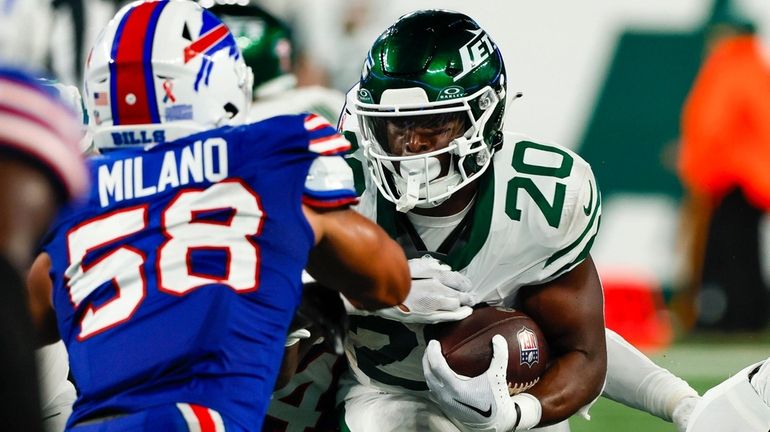  Jets running back Breece Hall works for yards during the...