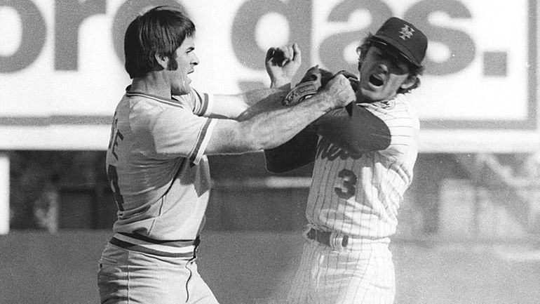 Pete Rose, left, of the Cincinnetti Reds swings at Mets shortstop...