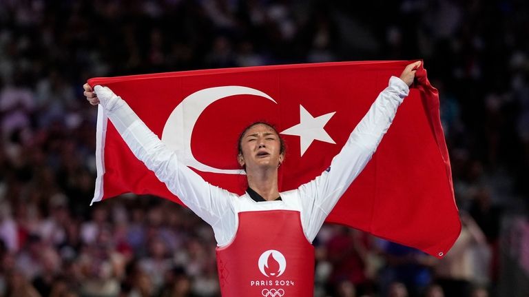 Turkey's Nafia Kus Aydin celebrates after winning the women's over...