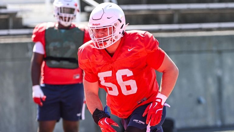 Stony Brook lineman and East Islip native Sebastian Regis does...