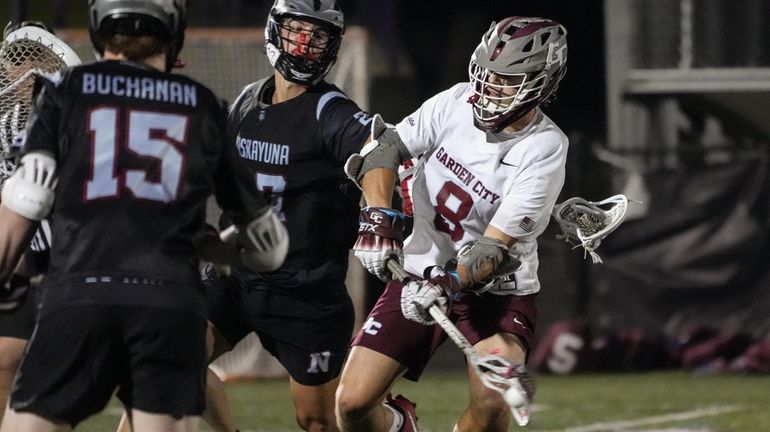 Jack Archer of Garden City boys lacrosse scores in the...