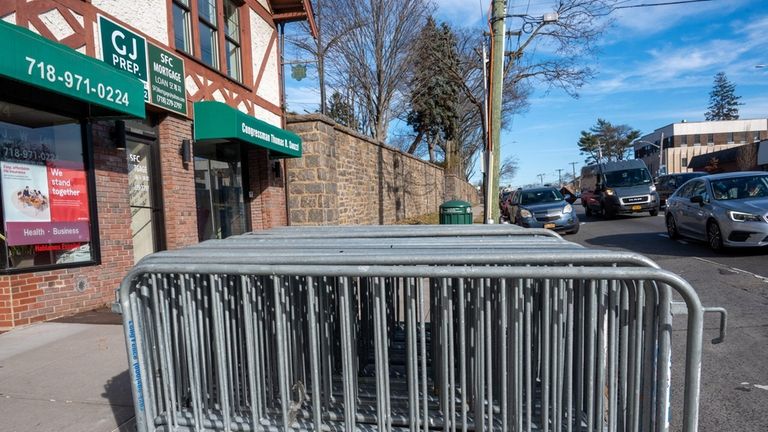 Barricades stand at the ready outside Rep. George Santos' office...