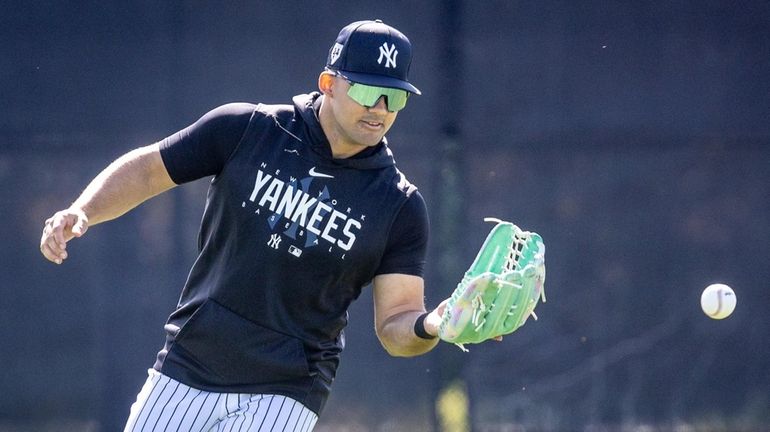 Yankees outfielder Jasson Dominguez takes part in outfield drills during spring training...