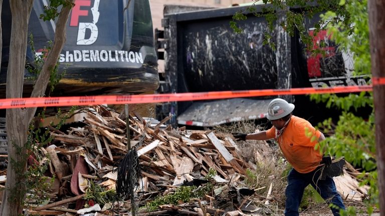 Workers begin demolition of the First Baptist Church of Sutherland...