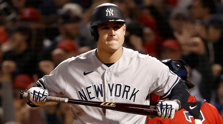 Anthony Rizzo of the Yankees reacts after striking out against the...