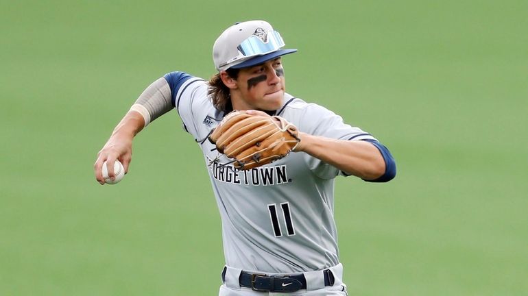 Georgetown's Andrew Ciufo fields the ball during an NCAA baseball...