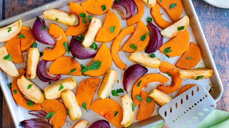 Butternut squash, red onion and apple roast together with a...