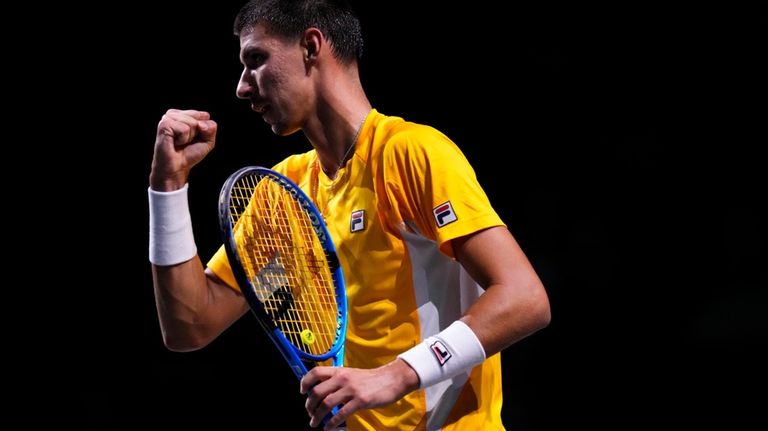 Australia's Alexei Popyrin celebrates after winning a point to Finland's...