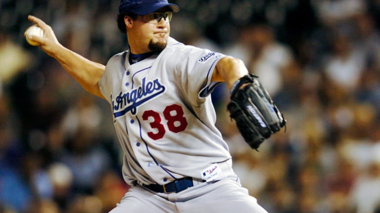 Los Angeles Dodgers relief pitcher Eric Gagne delivers a pitch...
