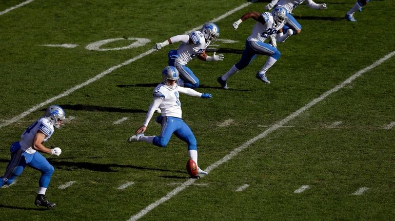 Detroit's Sam Martin kicks off during the first half against...