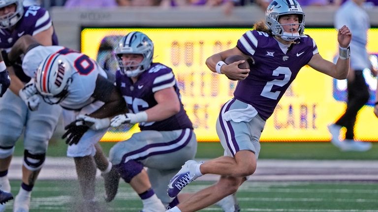 Kansas State quarterback Avery Johnson (2) runs during the first...