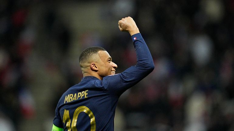 France's Kylian Mbappe celebrates after a goal during the Euro...