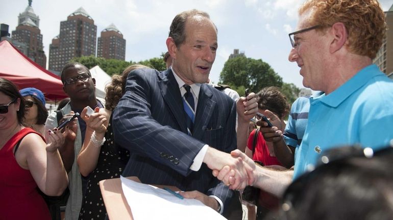 Former New York State Governor Eliot Spitzer speaks to the...