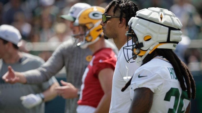 Green Bay Packers' quarterback Jordan Love watches NFL football training...