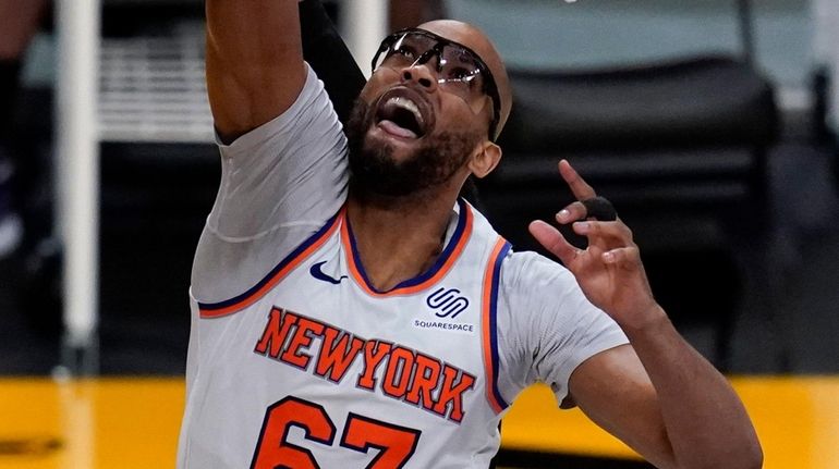 Knicks center Taj Gibson shoots during the third quarter of a...