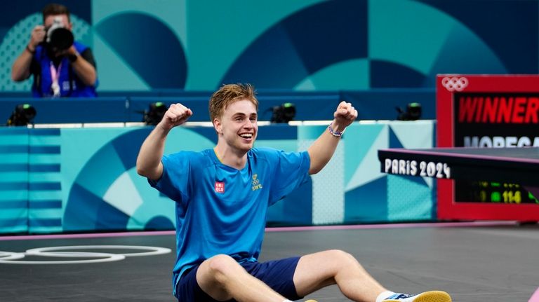 Sweden's Truls Moregrad reacts after his win against China's Wang...