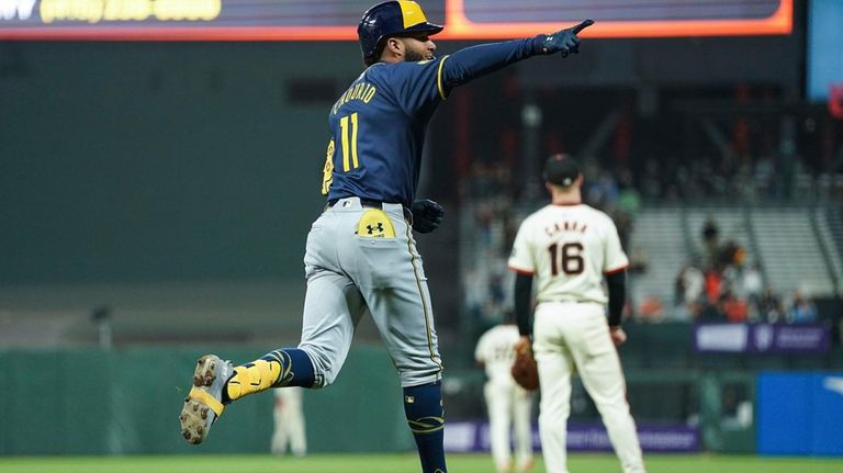 Milwaukee Brewers' Jackson Chourio, left, celebrates after hitting a two-run...