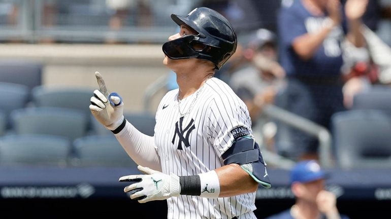 Aaron Judge of the Yankees runs the bases after his first-inning...