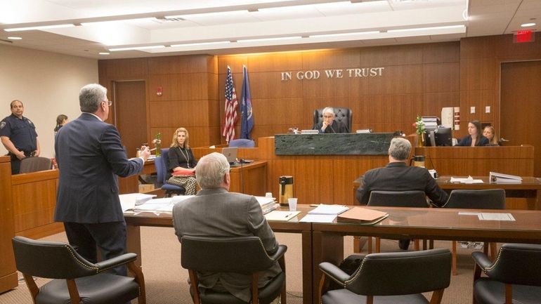 Judge Jerry Garguilo listens to testimony during a hearing at...