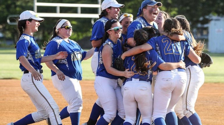 East Meadow celebrates its win of the Nassau Conference AA...