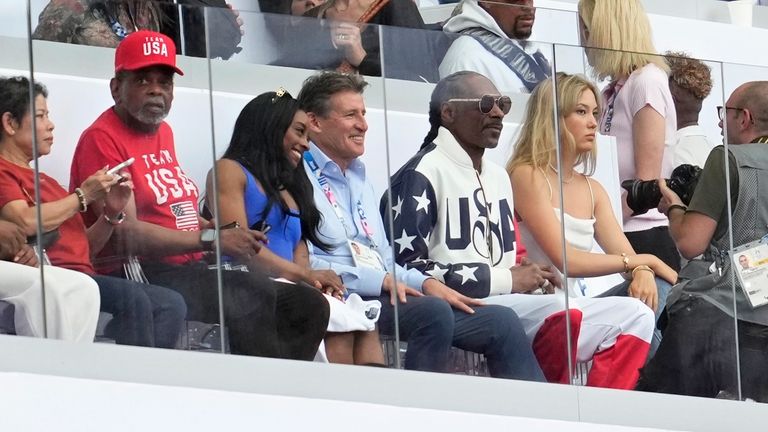 Gymnast Simone Biles, 3rd left, with her parents, sits next...