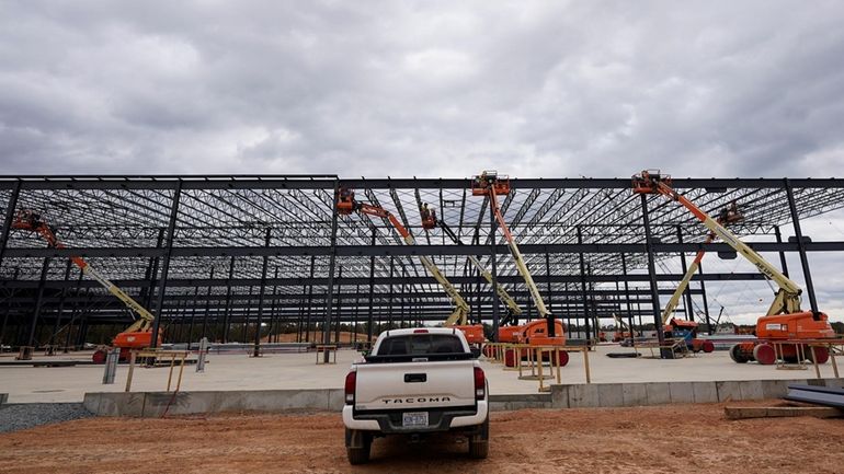 JLG lifts are operated outside a Hanwha QCells Solar plant...