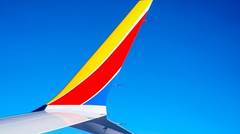 A Southwest Airlines 737 Max 8 airplane flies, Feb. 9,...