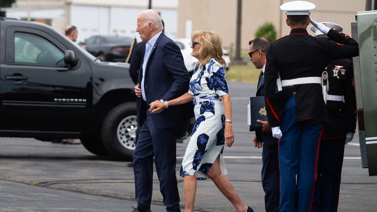President Joe Biden, left, and first lady Jill Biden arrive...