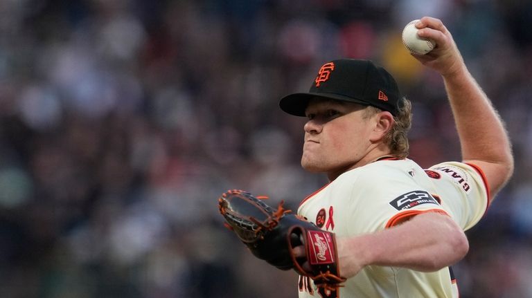 San Francisco Giants' Logan Webb pitches to an Oakland Athletics...