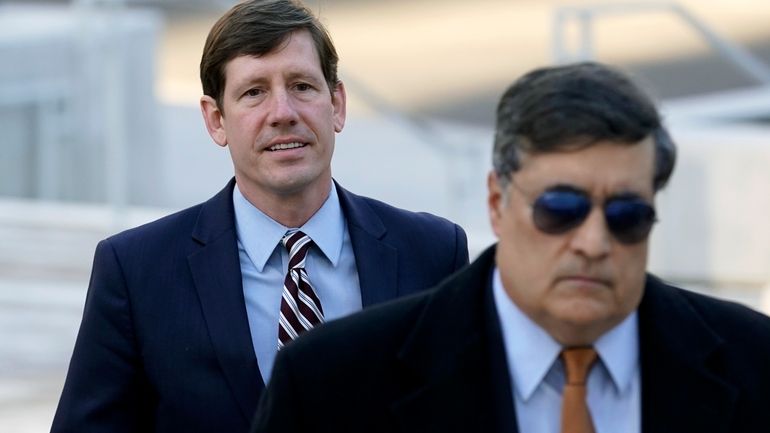 Former Tennessee Sen. Brian Kelsey, left, arrives at federal court,...