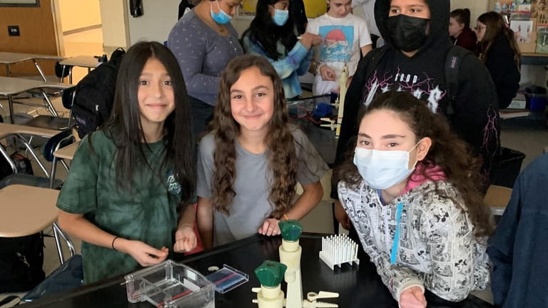 Elwood Middle School seventh-graders explored how DNA fingerprints work with...