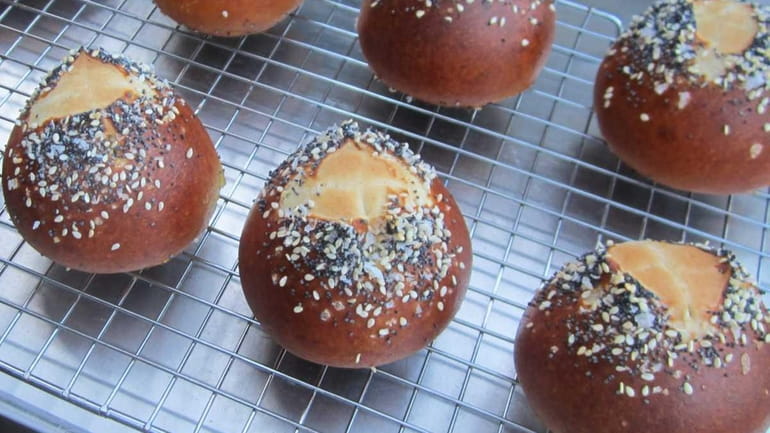 Give pretzel rolls a shiny, dark brown crust by boiling...