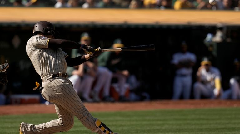 San Diego Padres' Juan Soto hits a grand slam against...