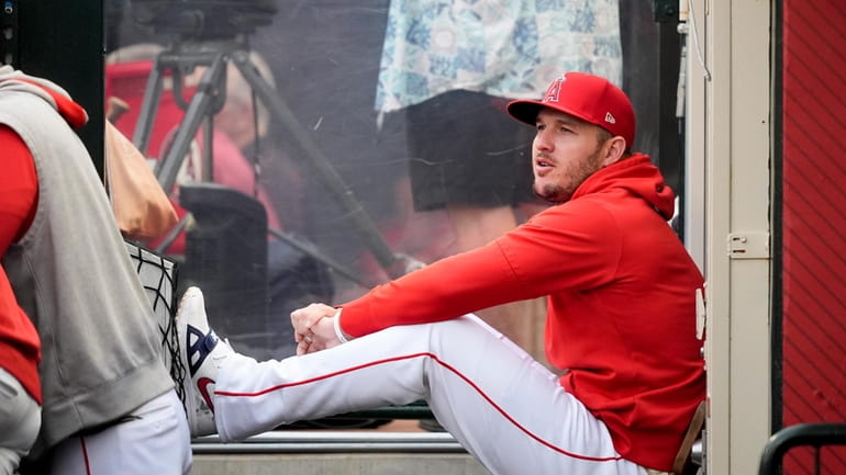 Los Angeles Angels center fielder Mike Trout sits in the...
