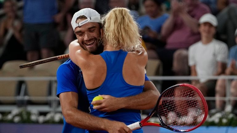 Czech Republic's Tomas Machac hugs Katerina Siniakova as they defeat...