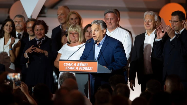 Hungarian Prime Minister Viktor Orban addresses the media after receiving...