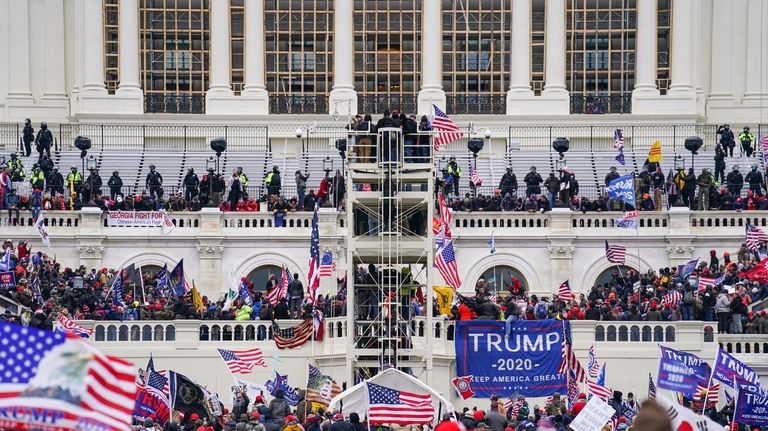 Insurrectionists loyal to President Donald Trump breach the Capitol in...