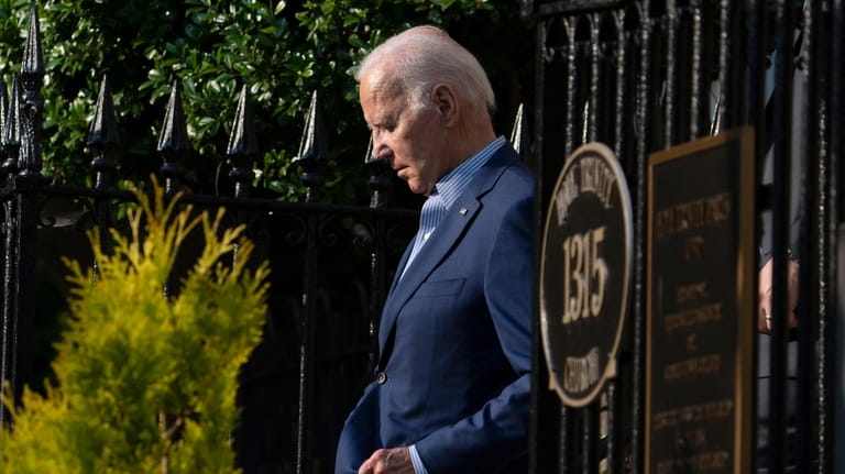 President Joe Biden leaves Holy Trinity Catholic Church in the...