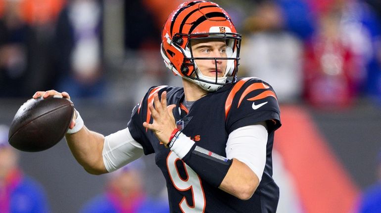 FILE - Cincinnati Bengals quarterback Joe Burrow (9) throws downfield...